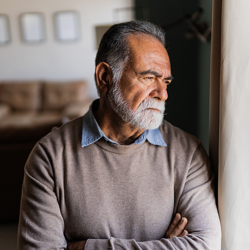 Senior man contemplating at home